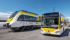 Ein Zug des Typs SWEG Talent 3 und ein bwregiobus stehen nebeneinander