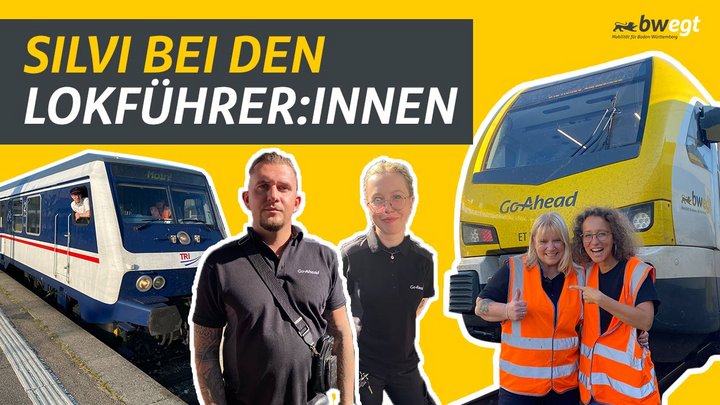 Mehrere Lokführer stehen vor Bahnen.