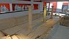 Innenaufnahme aus dem römischen Stadtmuseum Summelocenna in Rottenburg am Neckar. Die Aufnahme zeigt entlang einer Säulenreihe die antiken Überreste einer alten römischen Latrine.